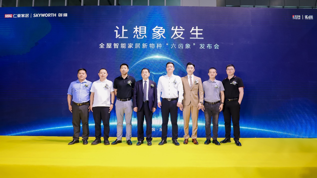 A group of men standing in front of a blue backdrop

Description automatically generated with medium confidence
